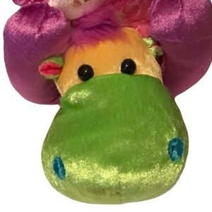 NWT pink, yellow, green and blue hippo stuffed animal with a pink bow.